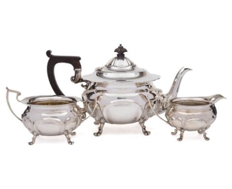 A George V silver three piece tea service, maker Joseph Rodgers &amp; Sons, Sheffield, 1910: of circular outline with wavy ed