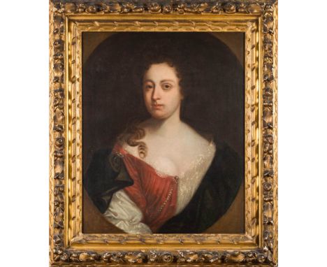 Circle of Godfrey Kneller [1646-1723]-Portrait of a lady, bust-length, with long brown wavy hair and brown eyes,wearing a lac