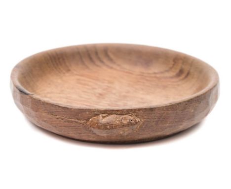 Mouseman, a Robert Thompson of Kilburn English oak nut dish: with carved mouse signature, 15.5 cm diameter.