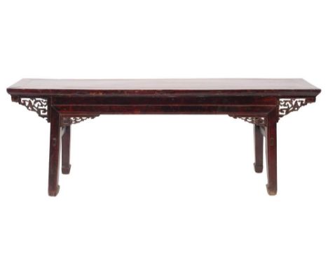 A Chinese stained wood rectangular altar table:, with pierced fret foliate scroll spandrels to the frieze, on square section 