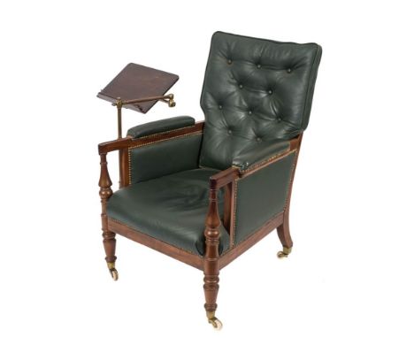 A William IV mahogany library armchair:, of bergere type, having a cane panel back , buttoned green leather loose cushion wit