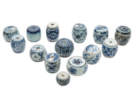 A collection of fourteen Chinese blue and white porcelain scroll weights: of barrel form, painted with auspicious symbols, fl