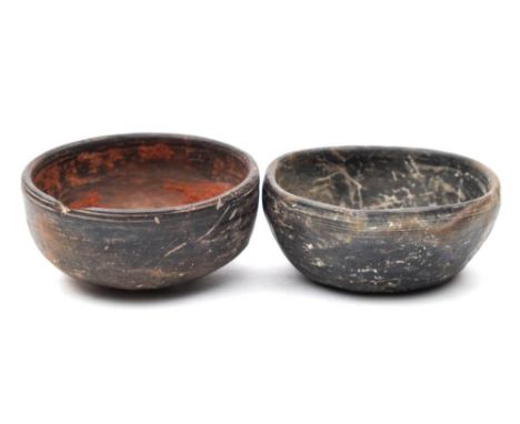 A Mayan pottery bowl: of plain circular form: 10cm. diameter, together with a similar bowl, 9.5cm. diameter. (2)