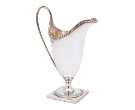 A George V silver cream jug, maker David &amp; Maurice Davis, Birmingham, 1914: of helmet-shaped outline, with reeded rim and