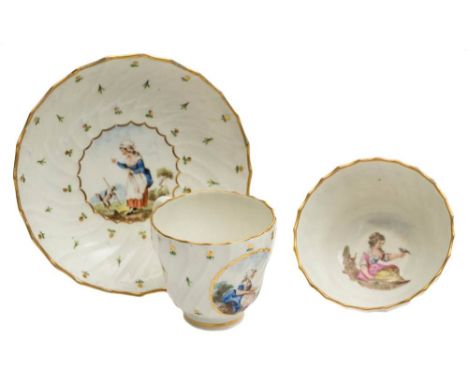A Caughley teacup, coffee cup and saucer with painting attributed to Fidelle Duvivier: of spirally fluted form, painted with 