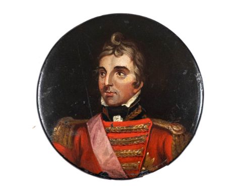 A 19th century papier mache snuff box: the circular lid decorated with a portrait of the Duke of Wellington, 8.5cm diameter. 