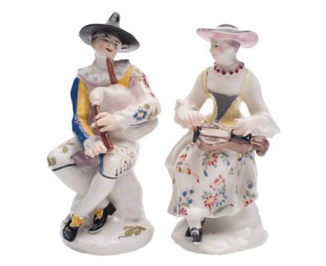 A matched pair of Bow figures of Harlequin and Columbine: after the Meissen originals, Harlequin playing the bagpipes and wea