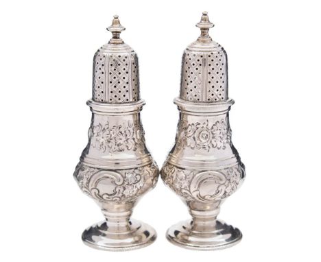 A pair of George V silver pepperettes, maker C S Harris &amp; Sons Ltd, London, 1910: of baluster form with domed pull-oo top