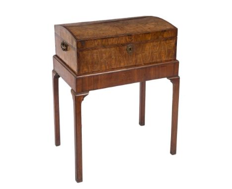 An 18th Century laburnum oyster veneer and rosewood diagonally crossbanded domed trunk on a Georgian mahogany stand:, the tru