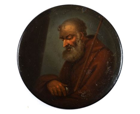 A 19th century papier mache snuff box: the circular lid decorated with a portrait of a monk with brown robes, 10.5cm diameter