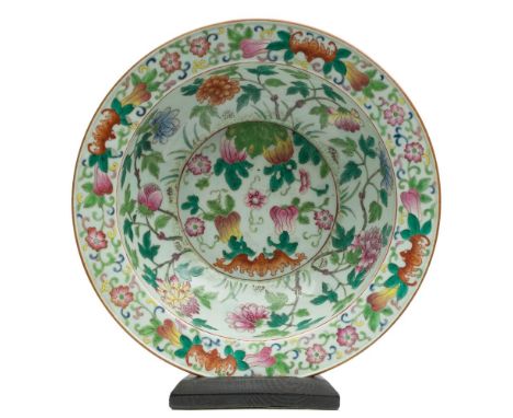 A Chinese export famille rose basin: with flattened everted rim, painted with bats, peony sprays, fruit and scrolling foliage