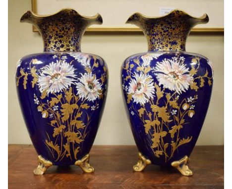 Pair of late 19th/early 20th Century pottery baluster shaped vases, each having heavily gilded enamel painted foliate decorat