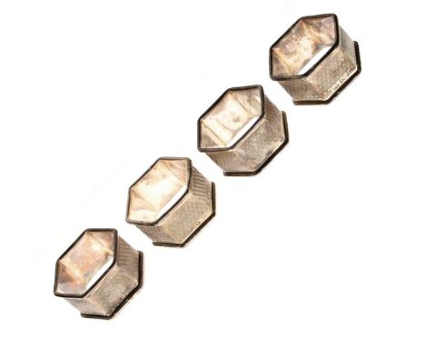 Set of four Elizabeth II engine turned silver hexagonal napkin rings, Sheffield 1961, 3.5oz approx   Condition: 