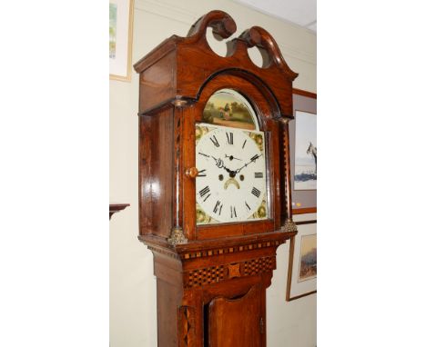 19th Century inlaid oak longcase clock, the hood with swan neck pediment, arch shaped glazed door flanked by cylindrical pill