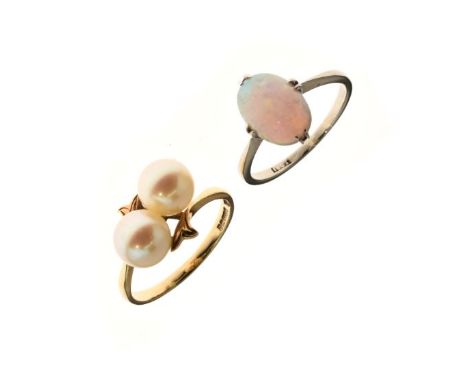 Opal set dress ring, the white metal shank stamped 18ct, together with a 9ct gold dress ring set two pearls   Condition: 