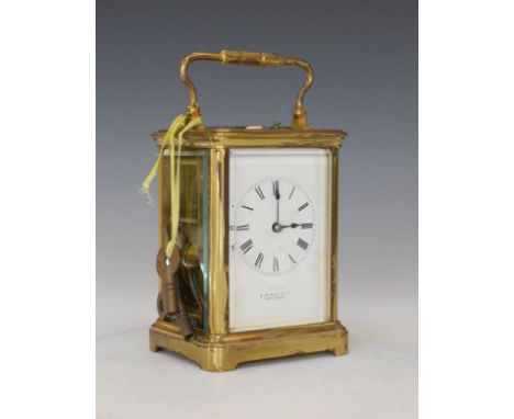French brass cased carriage clock with repeat movement, the white enamel dial with Roman numerals, 13.25cm high exclusive of 