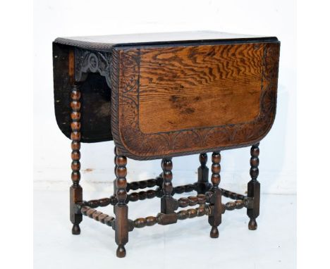 Carved oak two flap rectangular topped gateleg tea table on bobbin turned supports   Condition: 