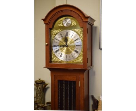 Reproduction mahogany finish grandmother clock, the brass and silvered dial with Roman numerals, long glazed door to the trun