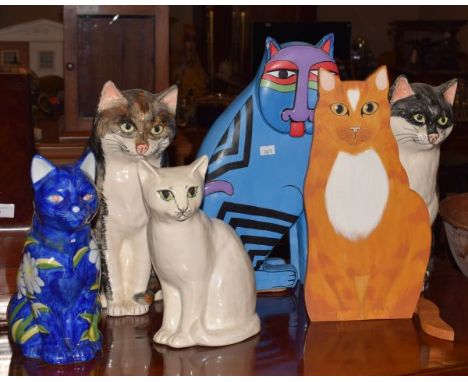 Two Babbacombe Pottery figures of seated cats, two other ceramic cats and two others   Condition: 