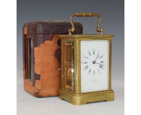 French brass cased carriage clock, the white enamel dial with Roman and Arabic numerals, 12.25cm high exclusive of handle, wi