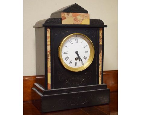 Late 19th century French black slate and marble cased mantel clock, the white enamel dial with Roman numerals   Condition: 