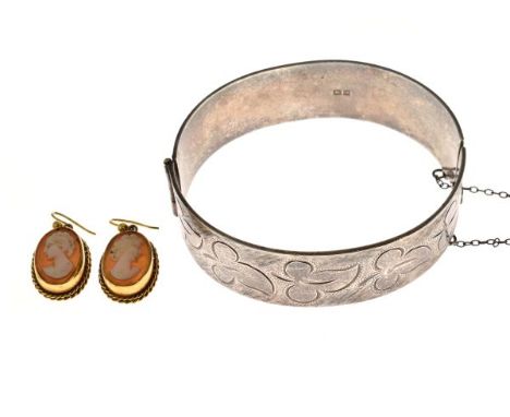 Silver engraved snap bangle and a pair of 9ct gold cameo earrings   Condition: 
