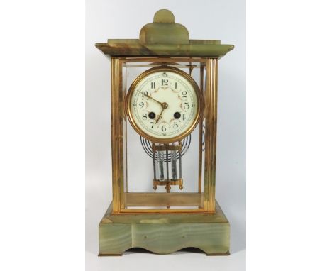 A French Onyx Four Glass Mantle Clock with enamel dial and mercury pendulum, 35 cm