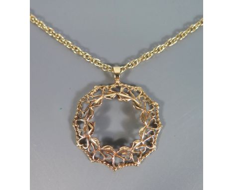 A 9ct Gold Sovereign Mount on chain, 10.8g