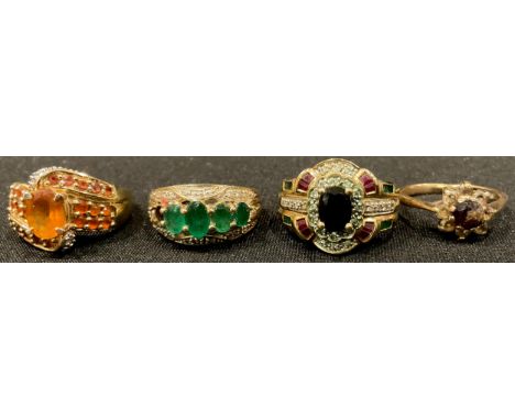 A 9ct gold dress ring, set with an arrangement of paste stones, size N, marked 375, QVC; three other 9ct gold dress rings, se