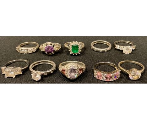A sterling silver dress ring, set with three princess cut graduated cubic zirconia, size N, marked 925; nine other sterling s