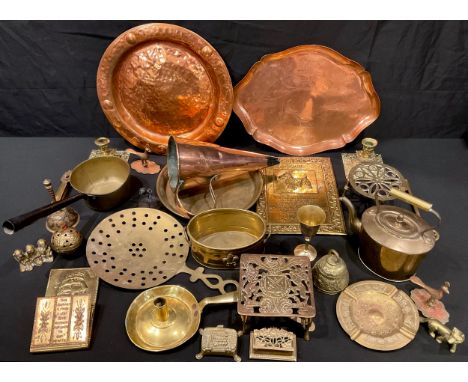 An Art Nouveau style copper tray, hand chased, JS&amp;S Birmingham; a brass jam pan; copper funnel; brass candlesticks, trive