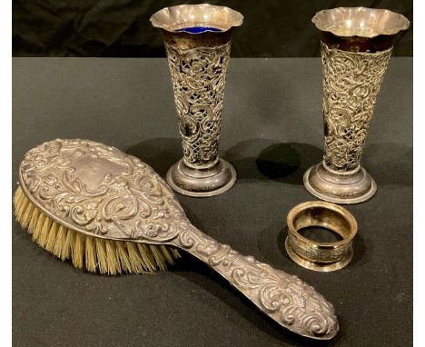 A pair of Edwardian silver pierced openwork posy vases, fluted edges, London 1902, 13cm, 133g; a George V silver backed hair 