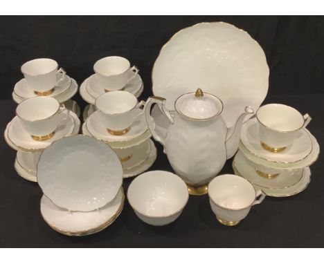 Aynsley Golden Crocus tea ware, including 10 cups and saucers, coffee pot, three tea plates, etc., gilt rims, printed marks 