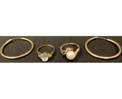 A 9ct gold ring, set with a faceted topaz and diamond chips, size K, 2.3g; a 9ct gold simulated pearl and diamond chip ring, 