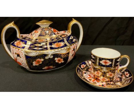 A Royal Crown Derby Imari 2451 pattern two handled oval sucrier and cover, 19cm wide, printed mark in pink; a 2451 pattern co