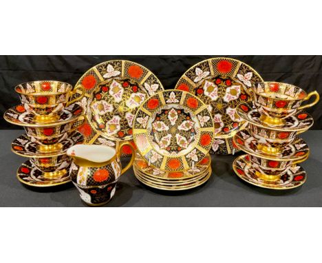 An Abbeydale Chrysanthemum pattern tea set, comprising six teacups, six saucers, six tea plates, milk jug, pair of sandwich p