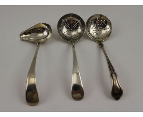 Two 20th century silver sugar sifting ladles, both Sheffield 1911, and 1937, together with a sliver ladle with pouring lip, c