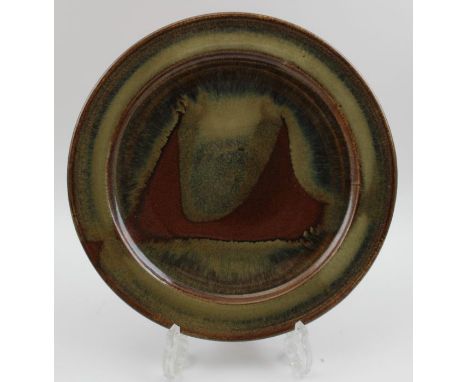 A Winchcombe pottery glazed stoneware plate, 29cm in diameter