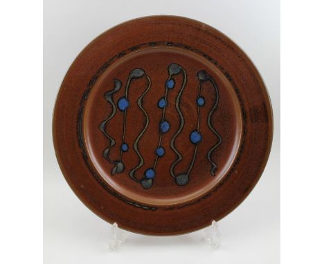 A glazed studio Winchcombe pottery charger, bears studio impressed mark, 38cm in diameterCondition report: no chips, cracks, 
