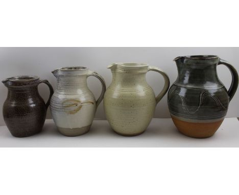 Two Winchcombe pottery glazed stoneware jugs, and two other studio glazed jugs