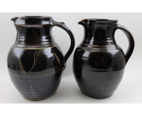 Two Winchcombe pottery treacle glazed pitchers