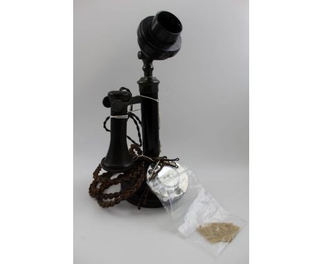 An early 20th century candlestick design telephone, black painted with Bakelite adjustable mouthpiece of GEC form