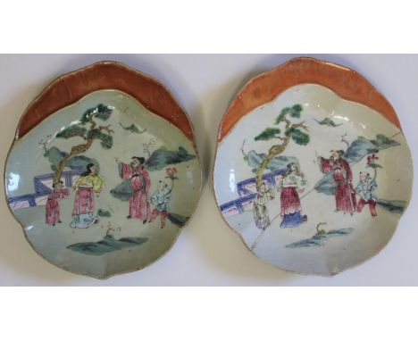 A pair of Chinese famille rose ceramic serving dishes, scallop moulded with handle form, one cream glazed, the other celadon 