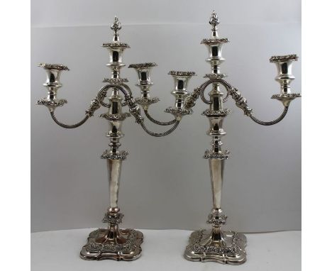                         A pair of Old Sheffield plate twin branch, three light candelabra, removable drip pans, fitted with c