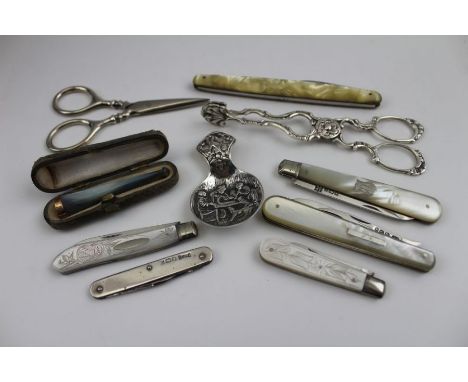 A mother-of-pearl cheroot holder with 9ct gold band, cased, various mother-of-pearl handled folding fruit knives with silver 