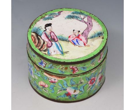 A CHINESE ENAMEL CIRCULAR BOX AND COVER with figure decoration on an apple green ground, 7.5cm diameter