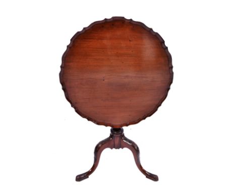 A CHIPPENDALE STYLE MAHOGANY PIE CRUST OCCASIONAL TABLE on fluted and baluster column and carved tripod base, 73cm diameter