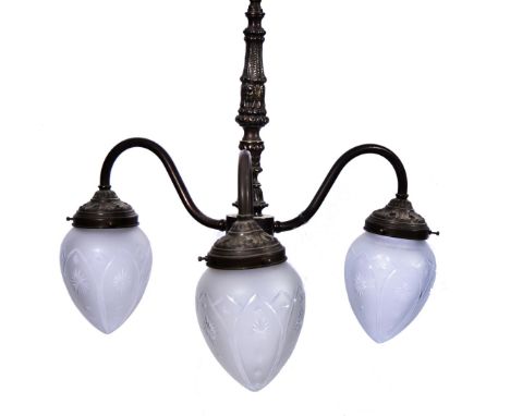 AN ITALIANATE COPPER ALLOY THREE BRANCH CEILING LIGHT of open scroll form with cut opaque glass tulip shades, approximately 4