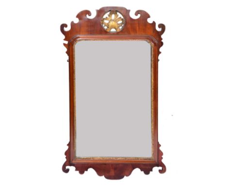 A GEORGE III MAHOGANY FRET FRAME HANGING WALL MIRROR with gilded ornament and scroll surround, 112 x 61cm