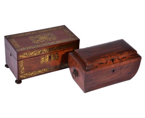 A REGENCY MAHOGANY AND EBONY INLAID TEA CADDY of sarcophagus form with brass ring handles, 29cm wide